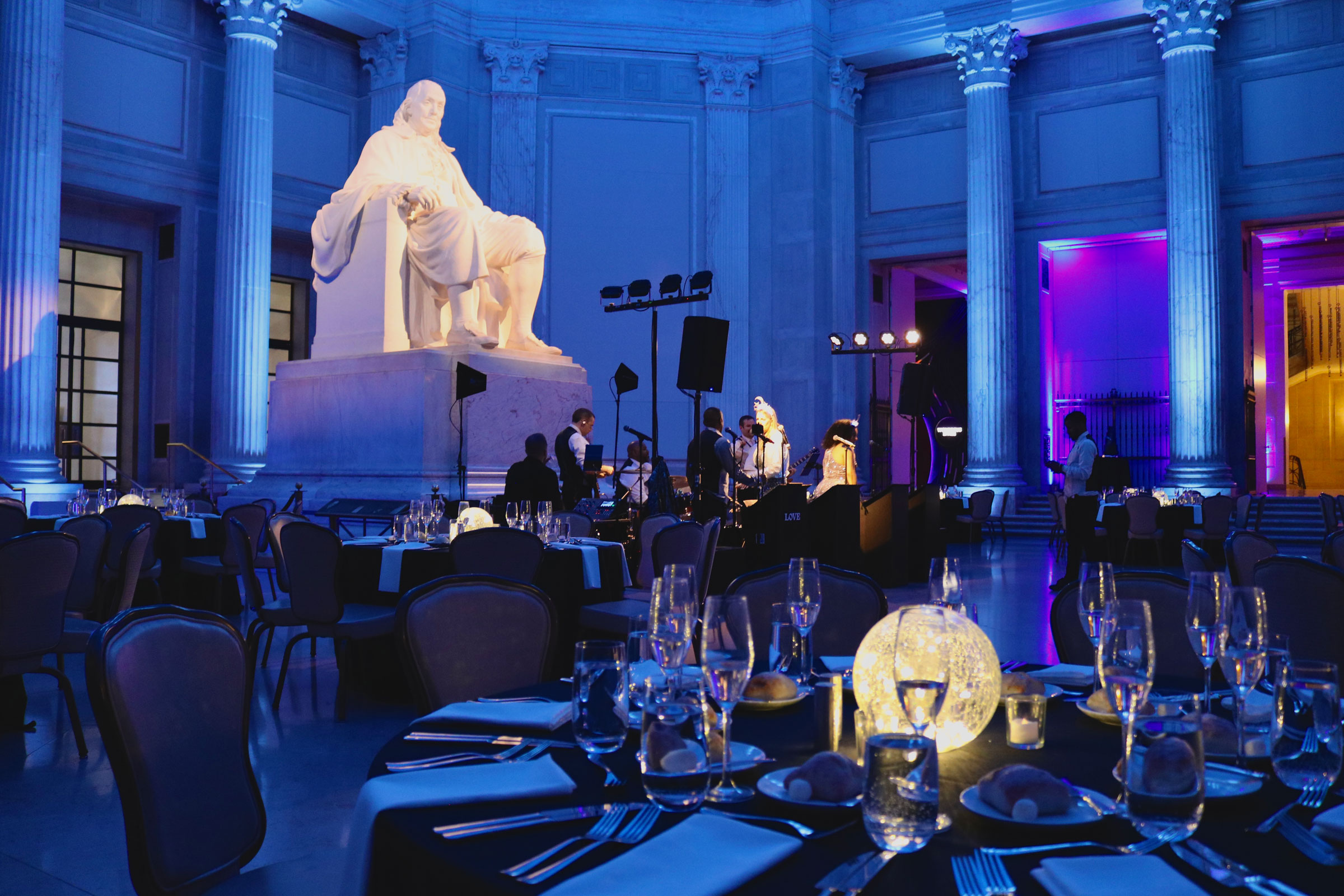 memorial statue lit in blue