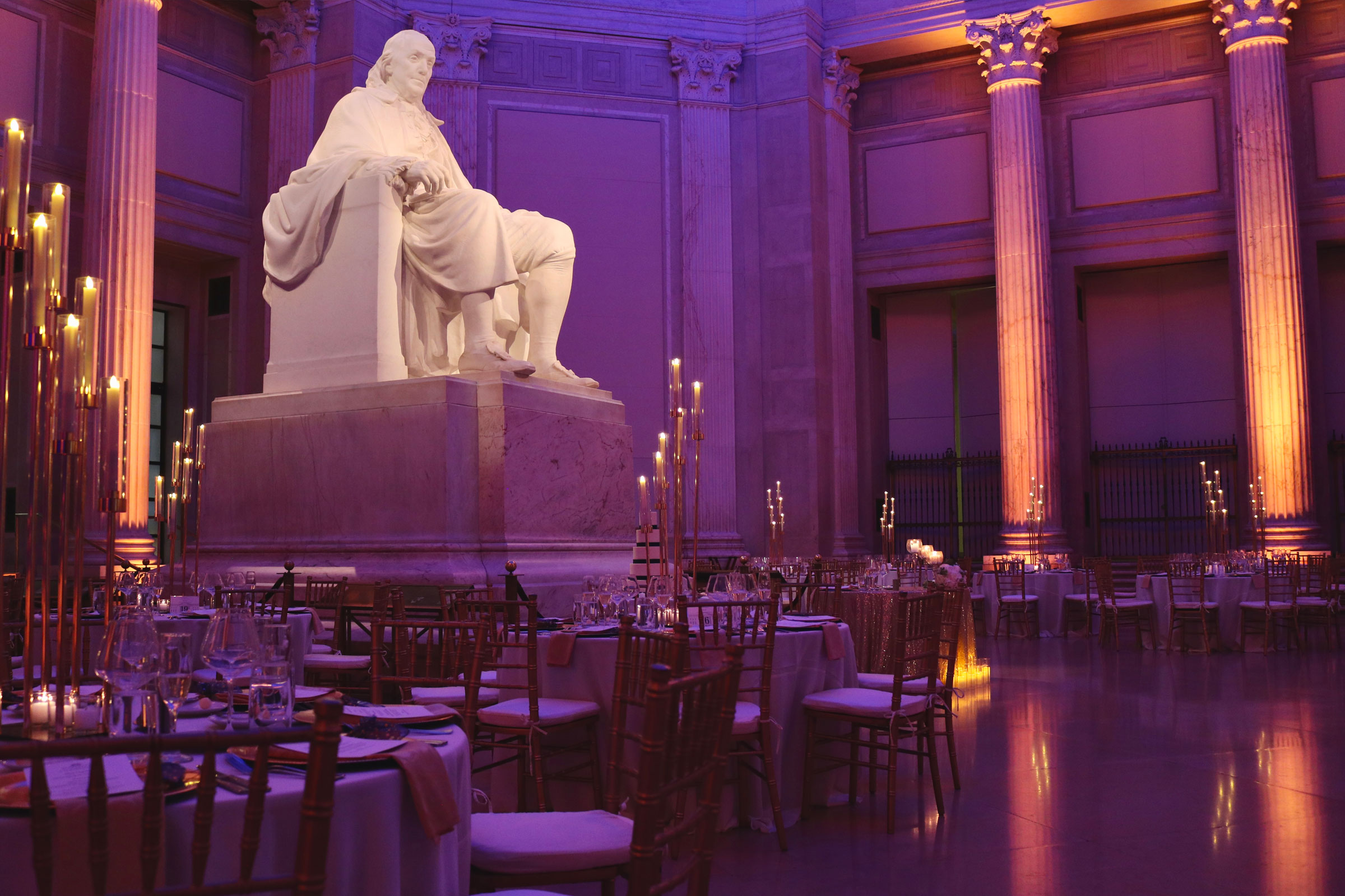 memorial statue lit in purple